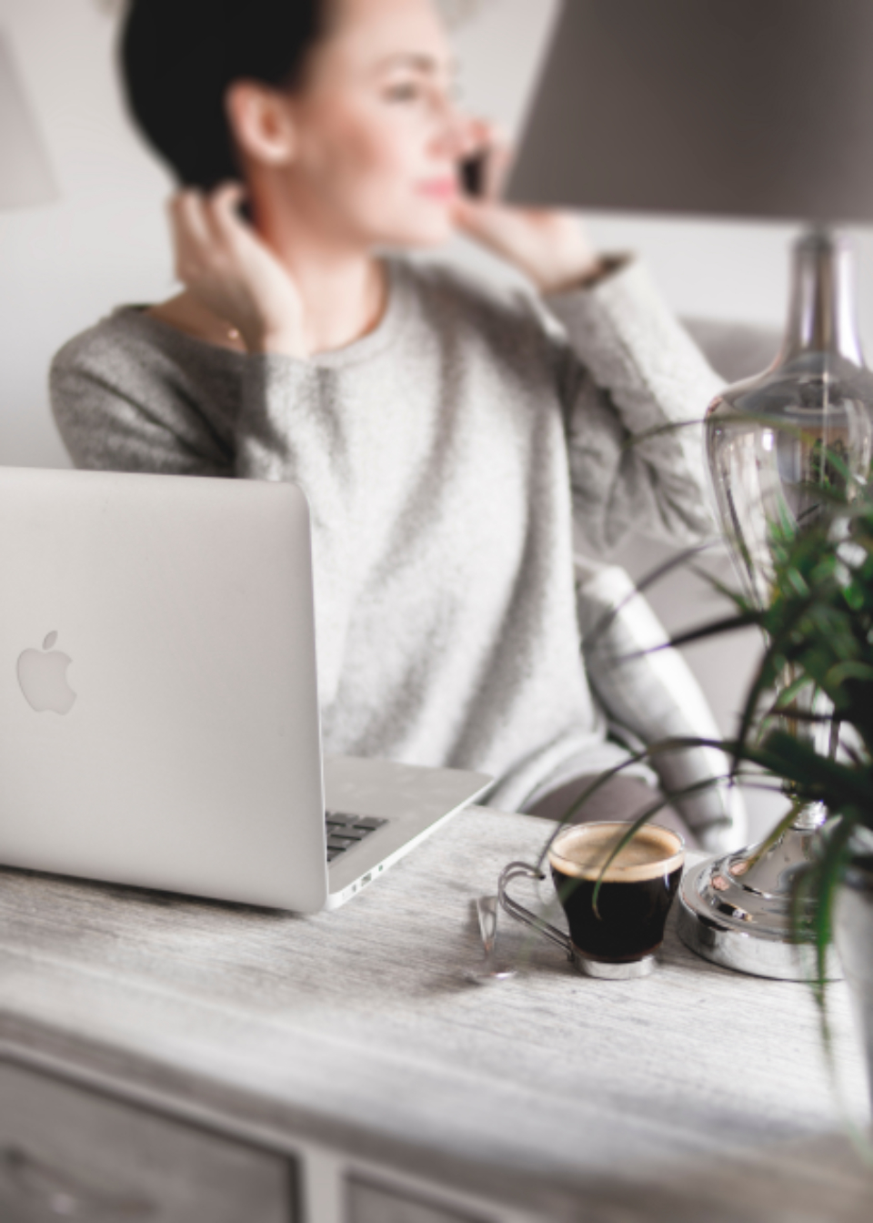 Over-the-shoulder: hand on keyboard and mouse at an agent desk